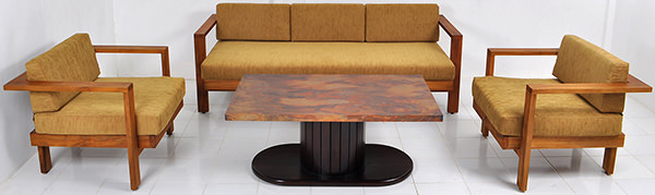 teak and yellow linen sofa with copper coffee table