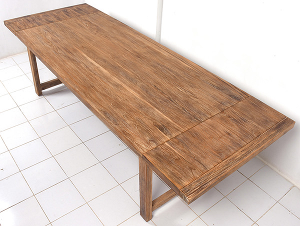 extendable solid teak dining table with rustic sanding and natural finish stain