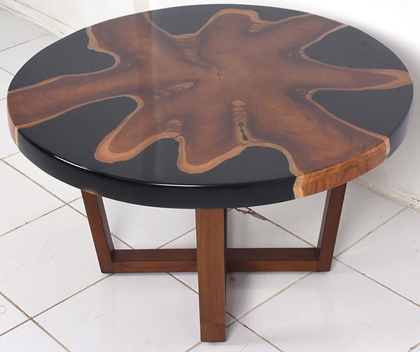 teak and resin coffee table with crossed legs