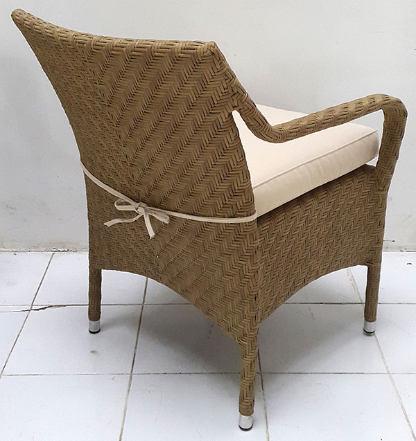 wicker armchair with white mattress