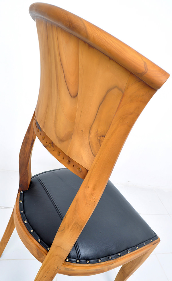 natural teak stain and black leather chair