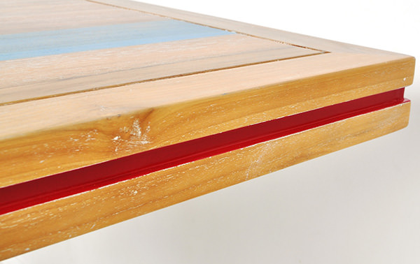 restaurant table with geometric lamination and solid colored finish