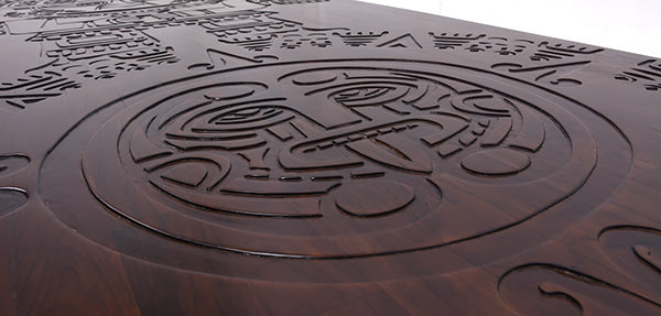 Coya oval table with wood carvings