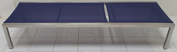 garden lounge chair with blue outdoor fabric and stainless steel legs