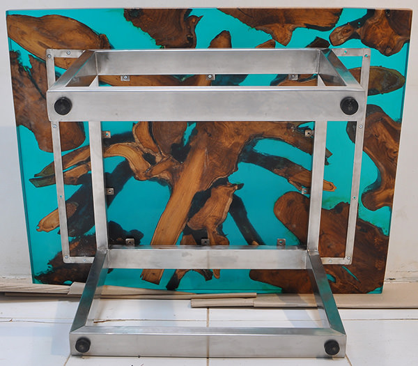 teak root and blue resin coffee table with stainless steel legs