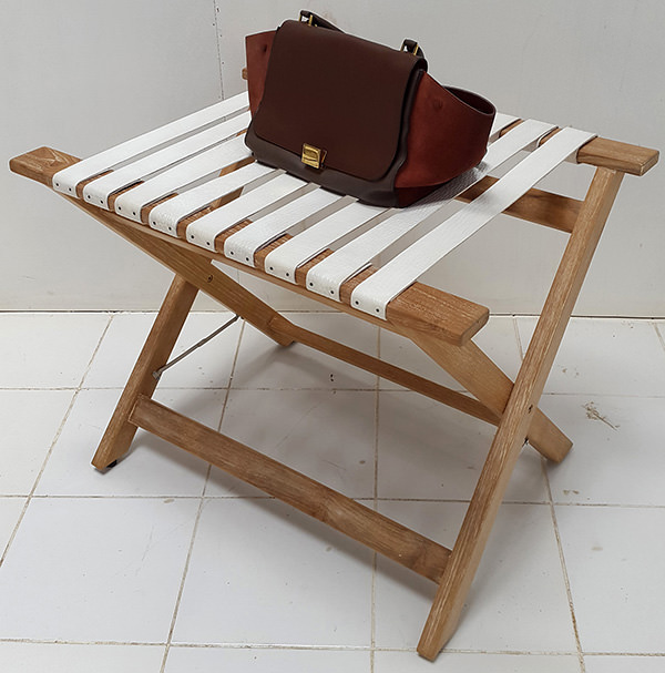 teak side table with white leather straps