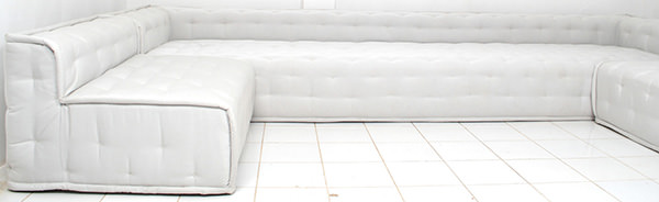 white L-shaped lounge sofa