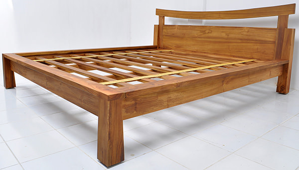 simple teak bed frame with natural stain and matte coatin