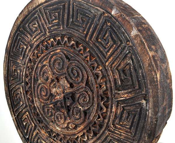 round wooden wall decor with black burnt charcoal reclaimed color and geometric carvings
