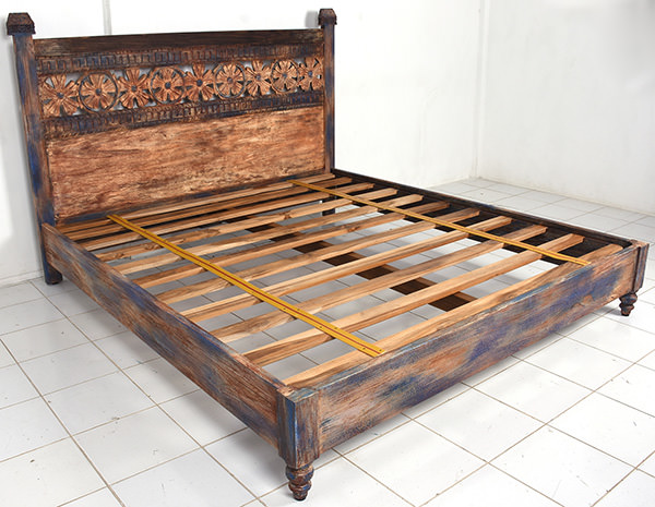 hand-carved wooden bed frame