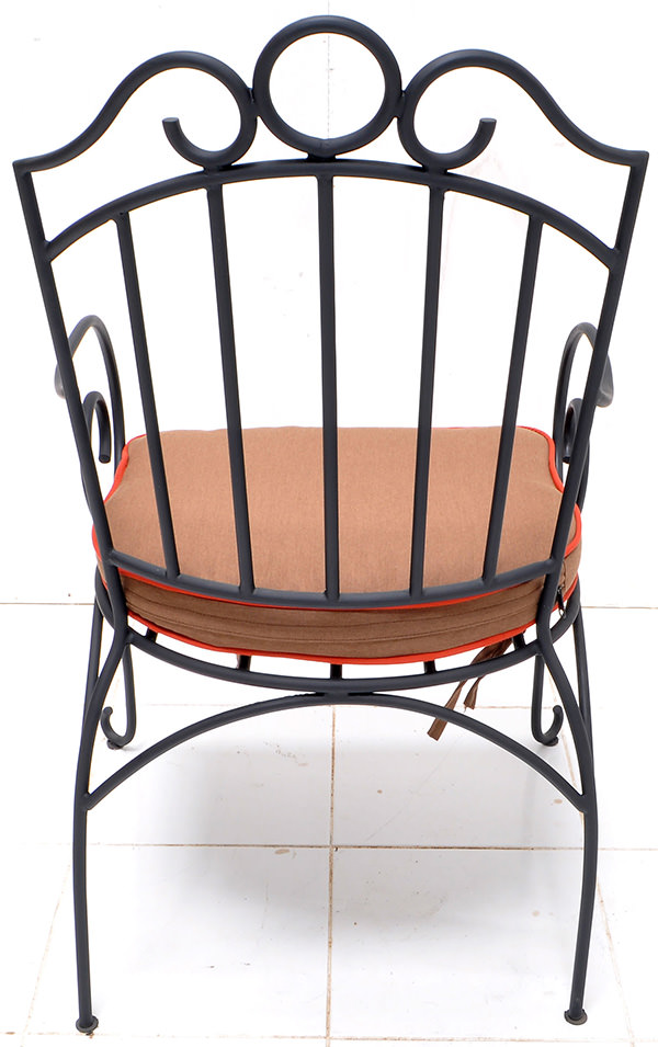 outdoor black iron armchair and linen cushion