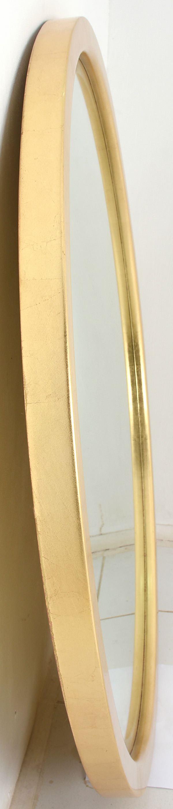 round mirror with golden leaf frame