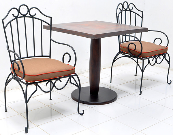 outdoor iron chair and copper table