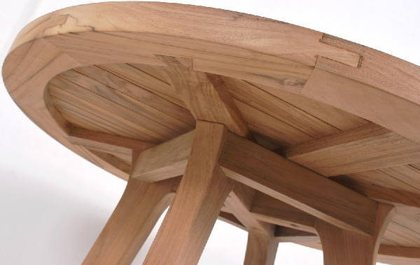 round teak table with open slats