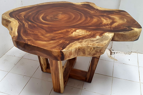 suar coffee table with crossed legs