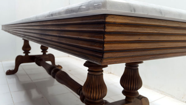 teak dining table with marble top and vintage finish