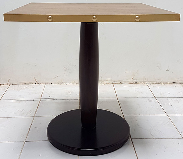 square restaurant table with brass edges and dark brown leg