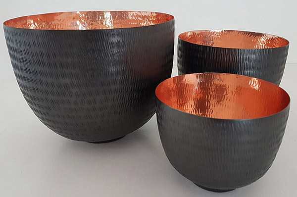 set of copper bowls hammered by hand