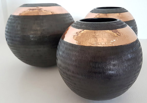 black and copper candle holders
