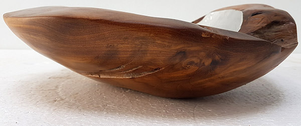 detail of a teak bowl with aluminium insert and a natural shape