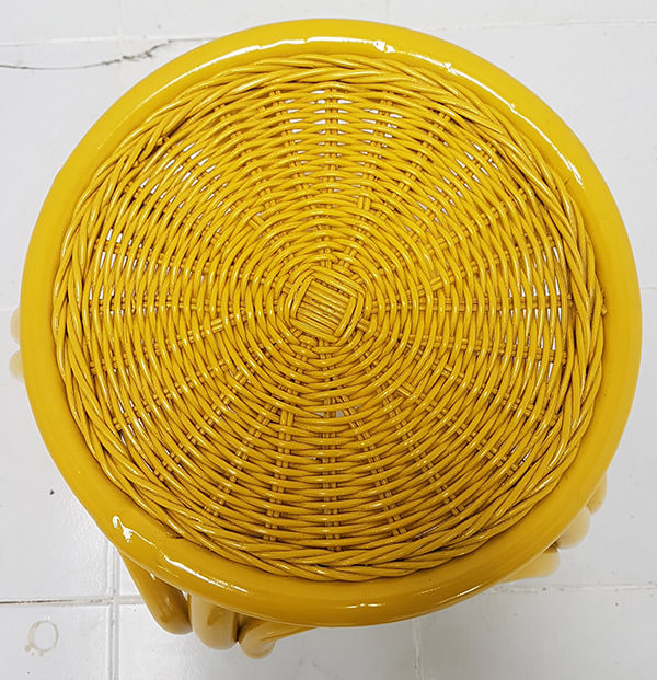 top view of the yellow cane and rattan side table