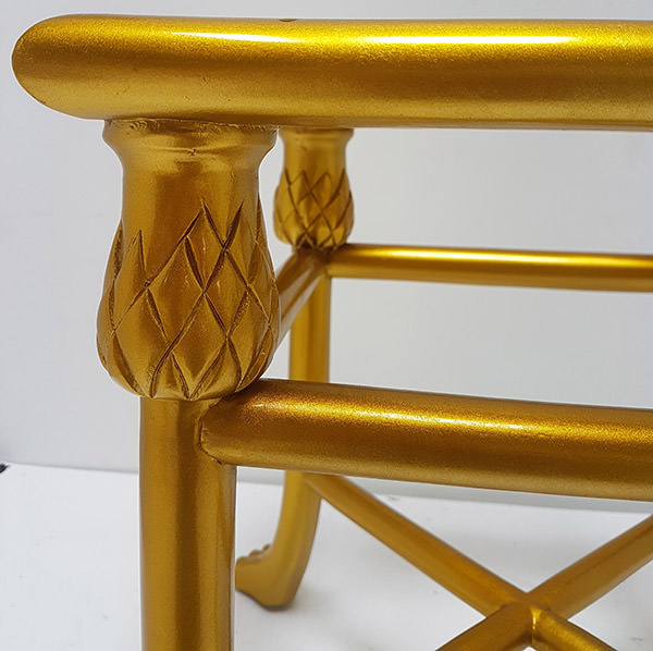 detail of the side table frame with gold finishing