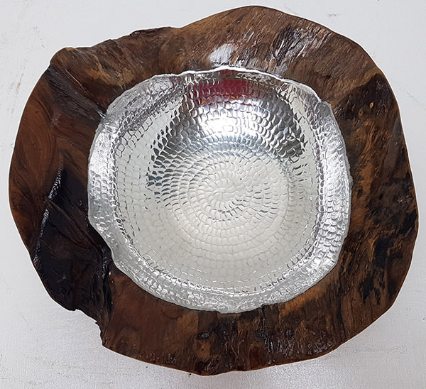 teak plate with a natural shape and a silver insert