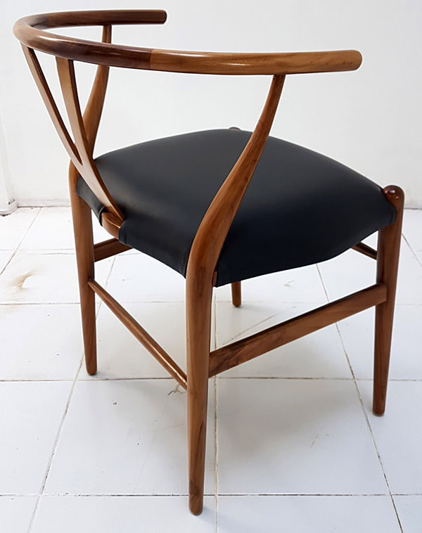 scandinavian dining chair with black leather seat and light brown stain