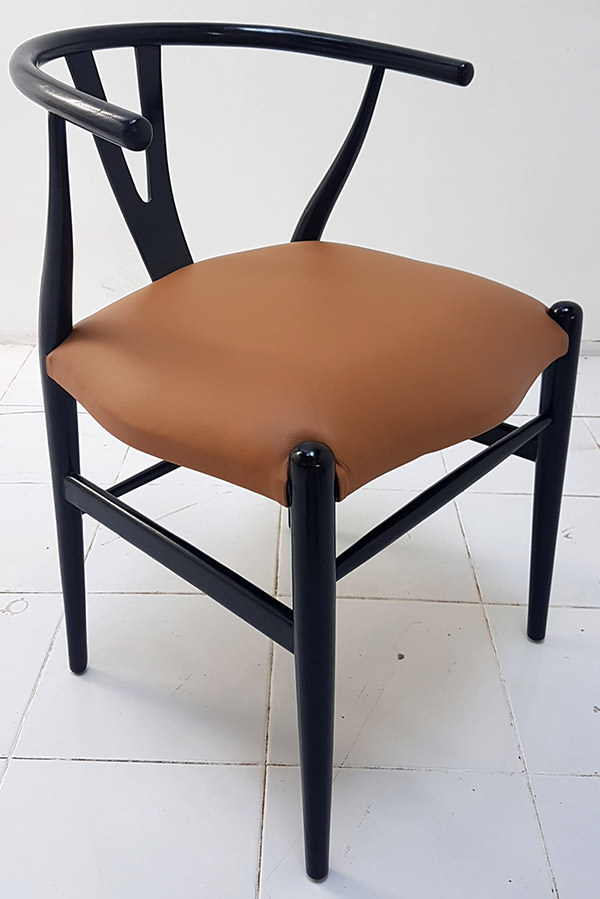 scandinavian dining chair with black leather seat and light brown stain with brown chair