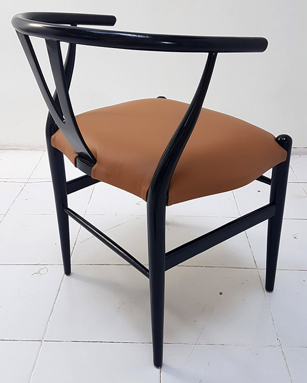 classic scandinavian dining chair with black leather seat and light brown stain with brown chair and black stain