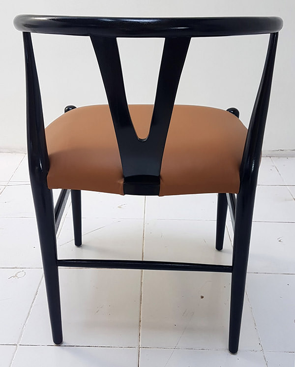 scandinavian dining chair with black leather seat and light brown stain