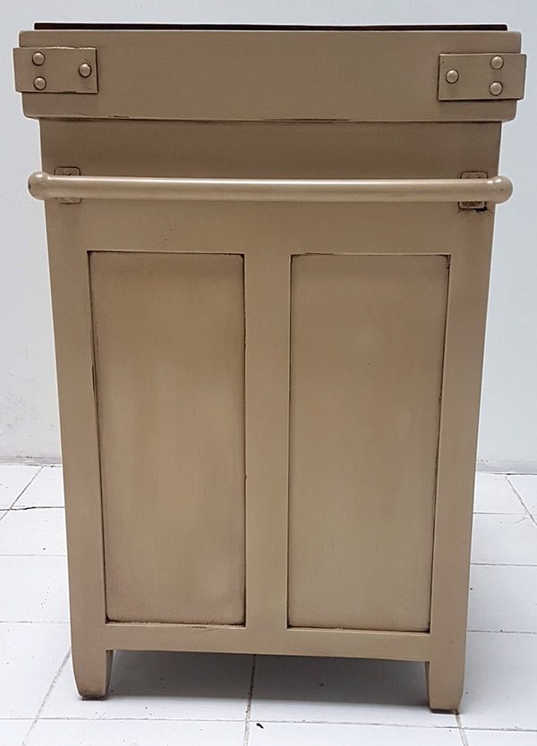 side of a mahogany buffet with white distressed finishing