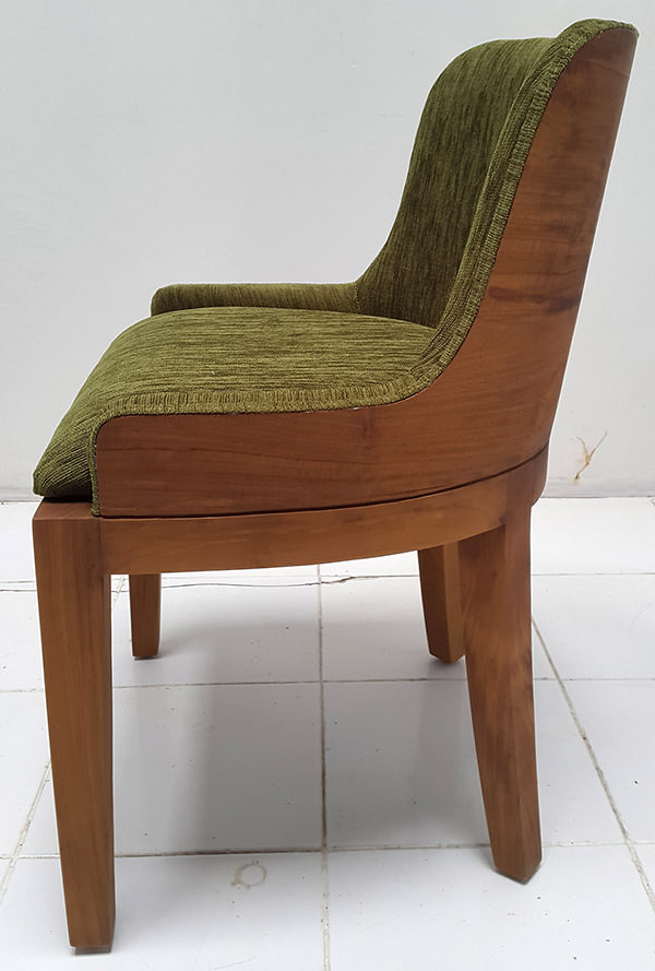 teak dining chair with green velvet upholstery and brown finish