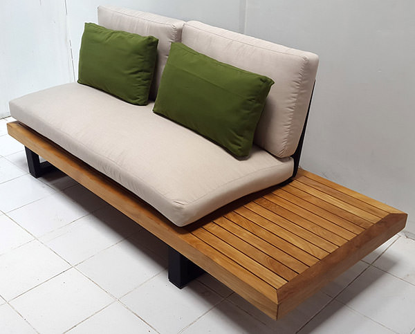 outdoor teak sofa with natural wood finish