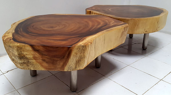 suar tables with round stainless steel legs and natural edges