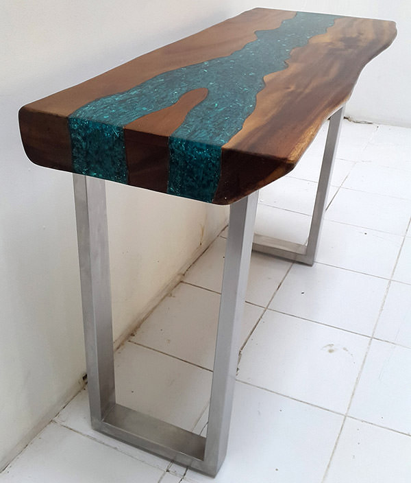 suar table with stainless steel legs and blue resin