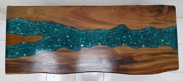 suar table with blue resin and drift wood inserts