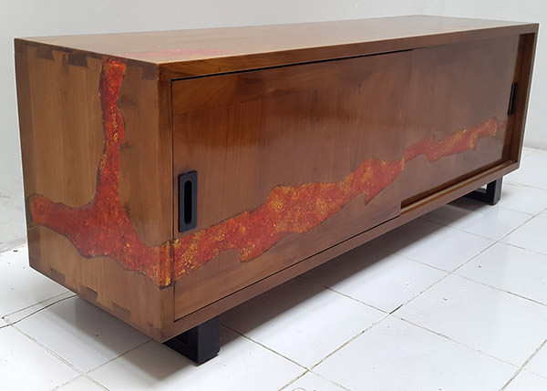 teak cabinet with red and orange resin all around