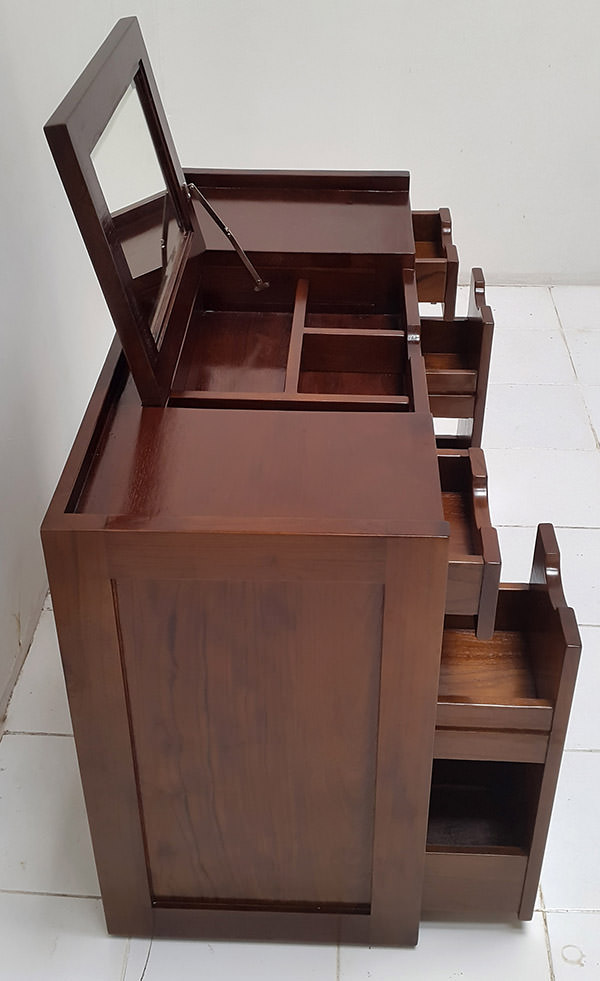 detail of a teak desk with 2 drawers and 2 doors