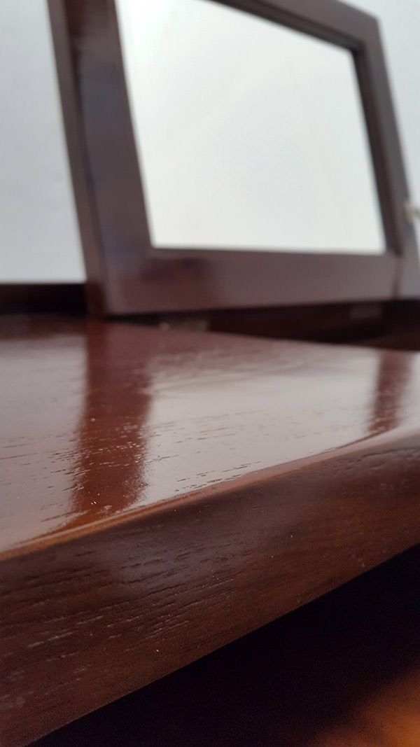 teak mirror on a Scandinavian desk