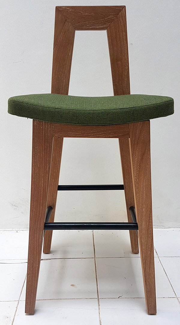 teak bar stool and plain linen