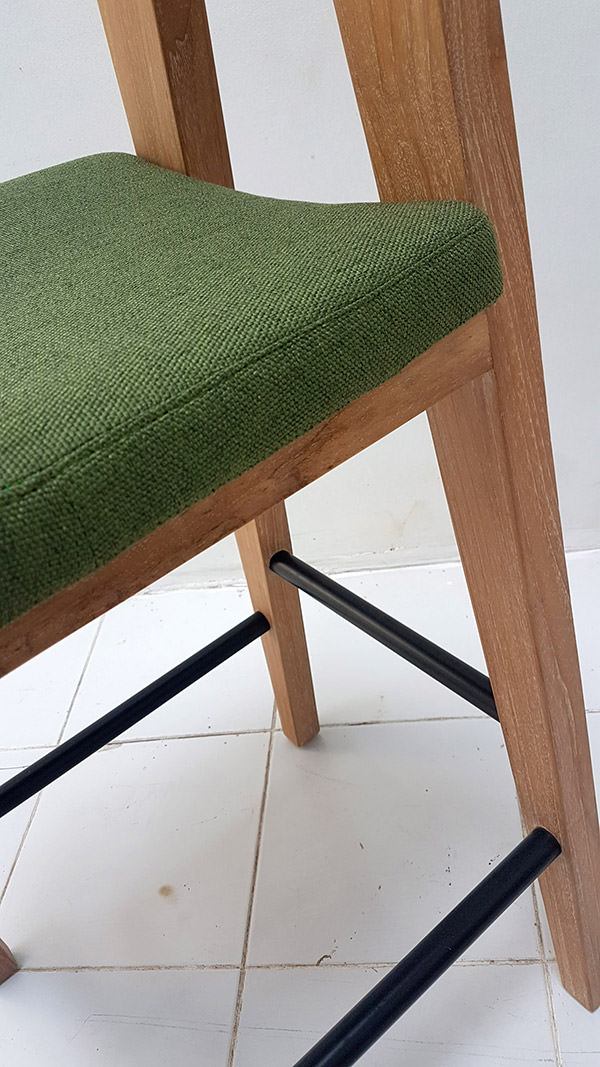 teak bar stool with linen seating and iron feet bar