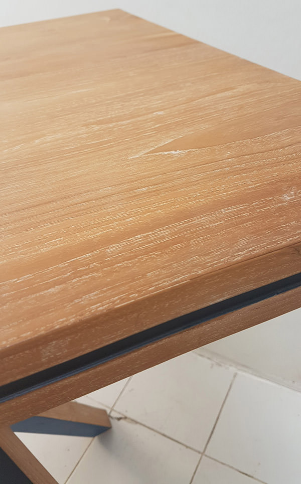 teak table top with solid color paint