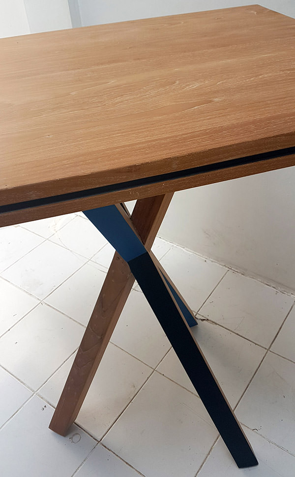 teak table with solid color paint