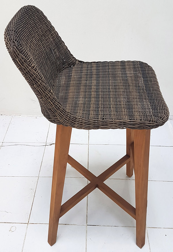 bar chair with wicker seat and wooden legs with natural finishing