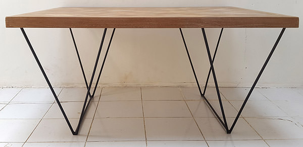 teak table with triangle iron legs
