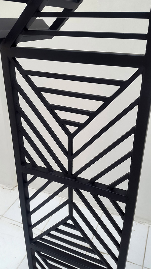 black iron legs with welded geometric pattern