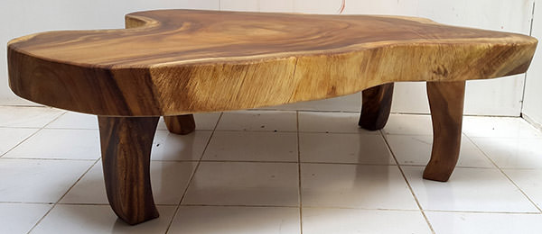 suar coffee table with organic shape and wooden legs