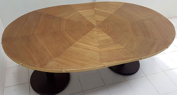 oval restaurant dining table with gold washed finish