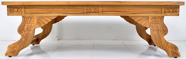 wooden coffee table with carvings